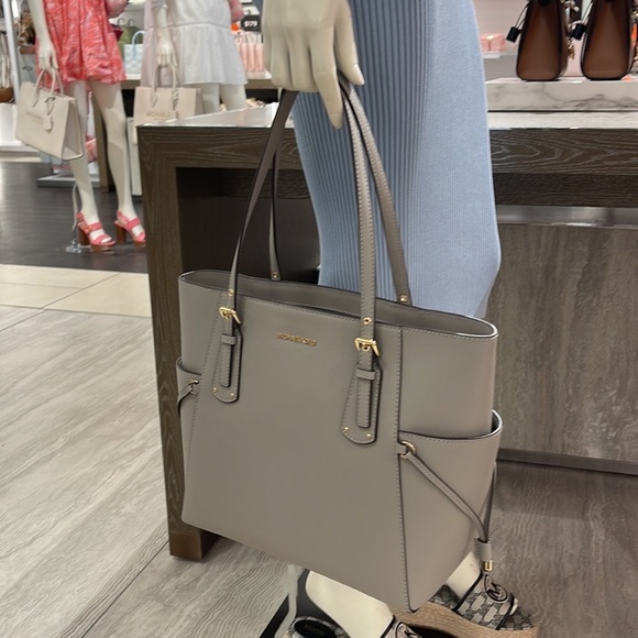 Voyager Small Saffiano Leather Tote Bag
Style# 30H1GV6T4T
NWT
COLOR: Pearl Gray - Picture 9 of 16